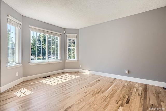 5370 S Jebel St, Centennial, CO 80015 - unfurnished room with a textured ceiling and wood finished floors