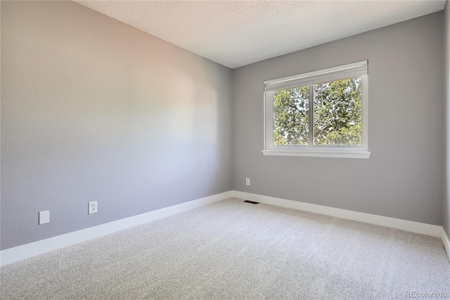 5370 S Jebel St, Centennial, CO 80015 - empty room featuring light carpet and a textured ceiling