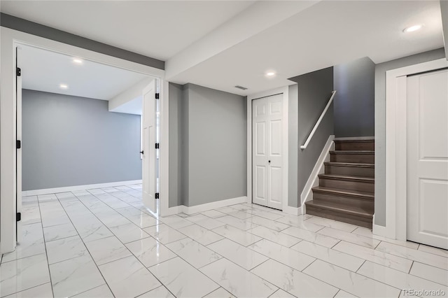 5370 S Jebel St, Centennial, CO 80015 - finished basement with recessed lighting, light marble finish flooring, and stairs