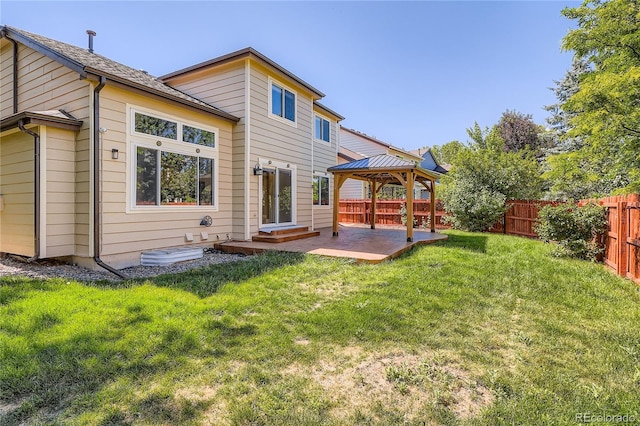 5370 S Jebel St, Centennial, CO 80015 - rear view of property featuring a gazebo, a fenced backyard, and a patio area