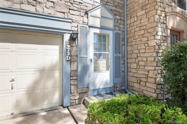2973 W 81st Ave Unit D, Westminster, CO 80031 - property entrance with stone siding and a garage