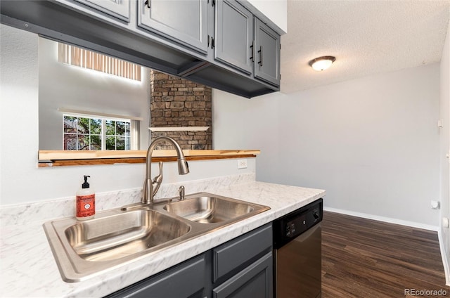 2973 W 81st Ave Unit D, Westminster, CO 80031 - kitchen featuring dishwasher, gray cabinets, light countertops, dark wood-type flooring, and a textured ceiling