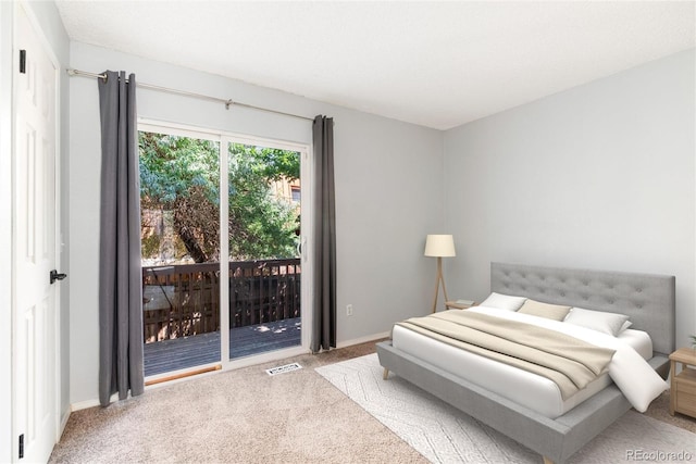 2973 W 81st Ave Unit D, Westminster, CO 80031 - carpeted bedroom featuring access to exterior and baseboards