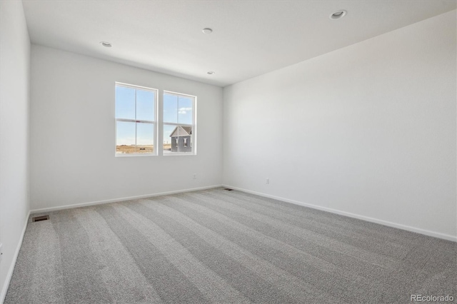 unfurnished room featuring carpet floors