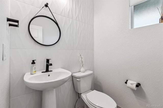 half bath featuring toilet