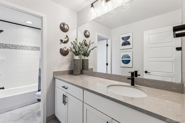 full bathroom with tile patterned flooring, vanity, shower / tub combination, and toilet