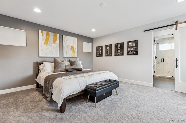 carpeted bedroom with recessed lighting, a barn door, baseboards, and connected bathroom