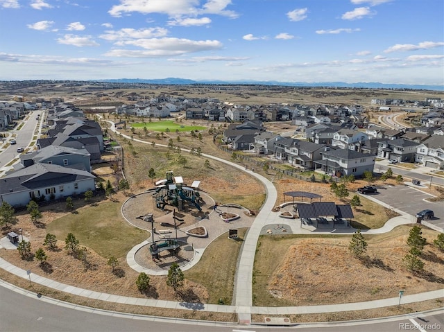 birds eye view of property with a mountain view and a residential view