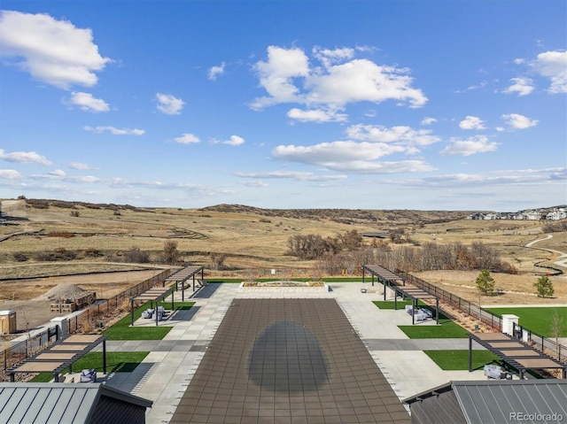 view of patio with a mountain view and fence
