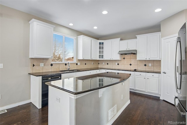 kitchen with white cabinetry, sink, a kitchen island, and black dishwasher