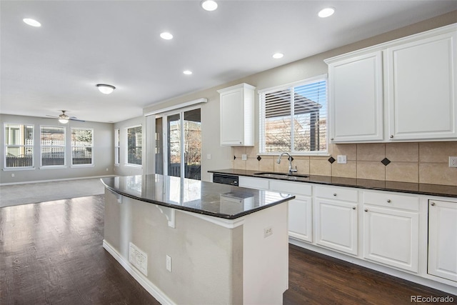 kitchen featuring white cabinetry, sink, and ceiling fan