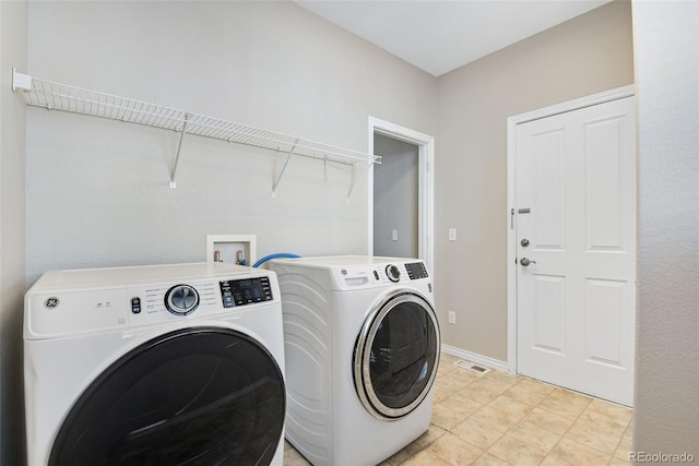 washroom with washing machine and dryer