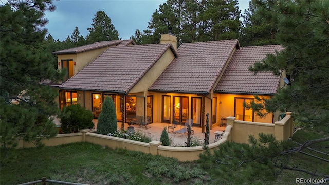 rear view of house featuring a patio area