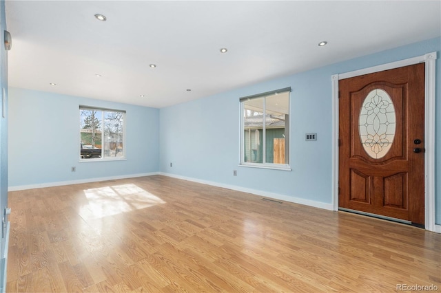 entrance foyer with light hardwood / wood-style flooring