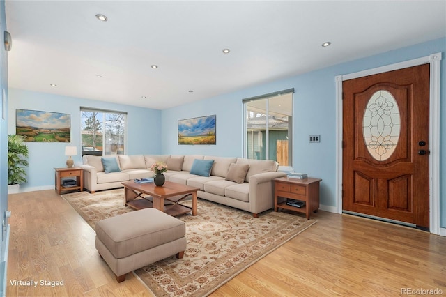 living room with light hardwood / wood-style floors