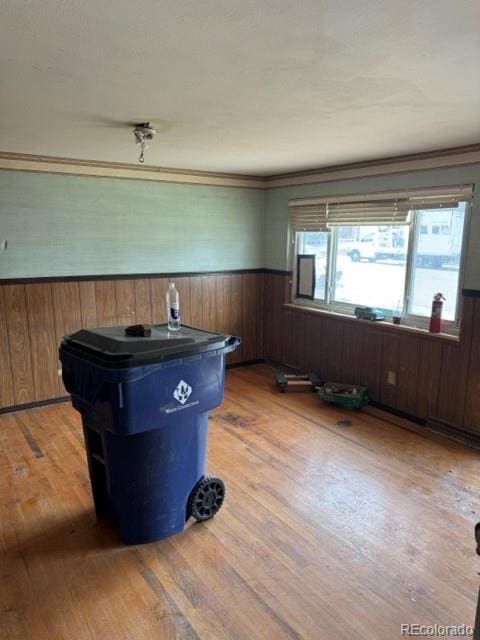 8250 Ralph Ln, Denver, CO 80221 - interior space with a wainscoted wall, wood finished floors, wooden walls, and crown molding