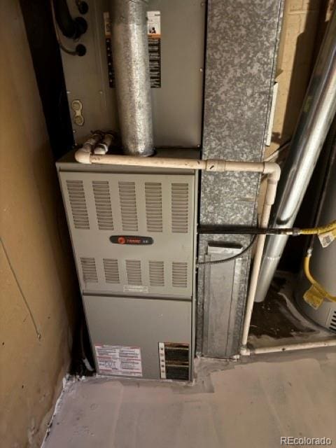 8250 Ralph Ln, Denver, CO 80221 - utility room with heating unit
