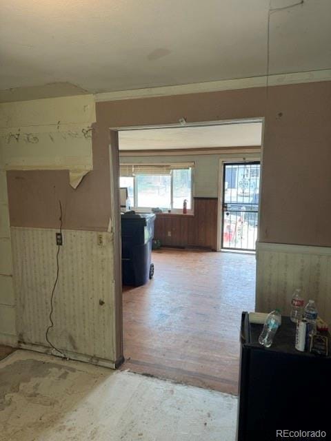 8250 Ralph Ln, Denver, CO 80221 - hallway featuring wainscoting and wooden walls