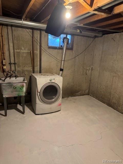 8250 Ralph Ln, Denver, CO 80221 - unfinished below grade area with washer / clothes dryer and a sink