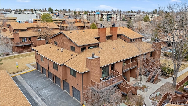 birds eye view of property with a residential view