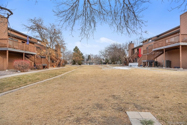 view of yard with stairway and a residential view