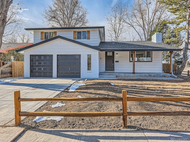 view of front of house featuring a garage and covered porch