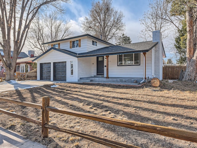 view of front facade featuring covered porch and a garage