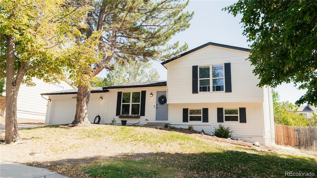 split level home featuring a garage