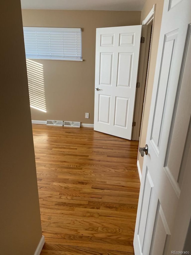 interior space with hardwood / wood-style floors