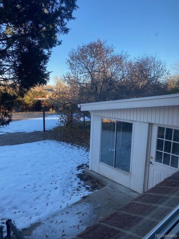 view of snow covered property