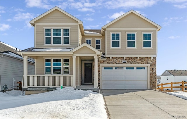 view of front of house featuring a garage and covered porch