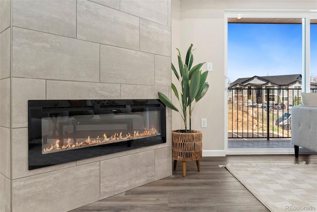 interior details with wood-type flooring and a fireplace