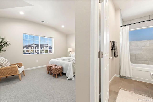 carpeted bedroom featuring lofted ceiling