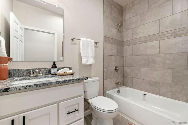 full bathroom with toilet, tiled shower / bath, and vanity