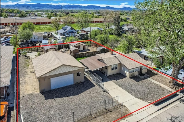 4835 Harlan St, Wheat Ridge, CO 80033 - aerial view of residential area with property boundaries highlighted and a mountainous background
