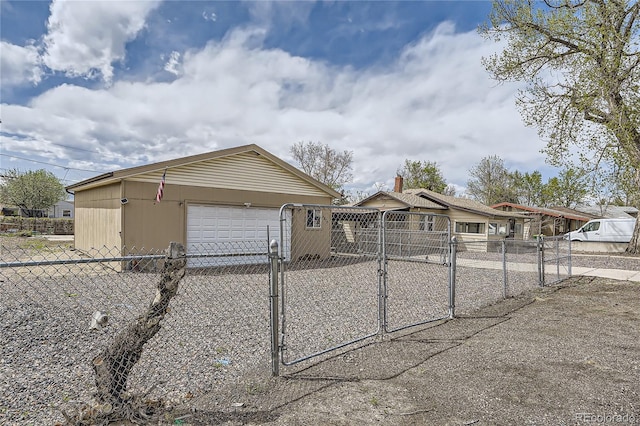 4835 Harlan St, Wheat Ridge, CO 80033 - view of front of home with a gate and an outdoor structure