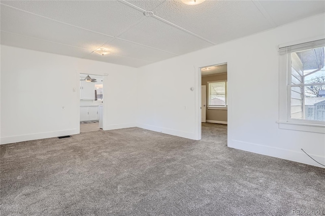 4835 Harlan St, Wheat Ridge, CO 80033 - carpeted spare room with healthy amount of natural light and baseboards