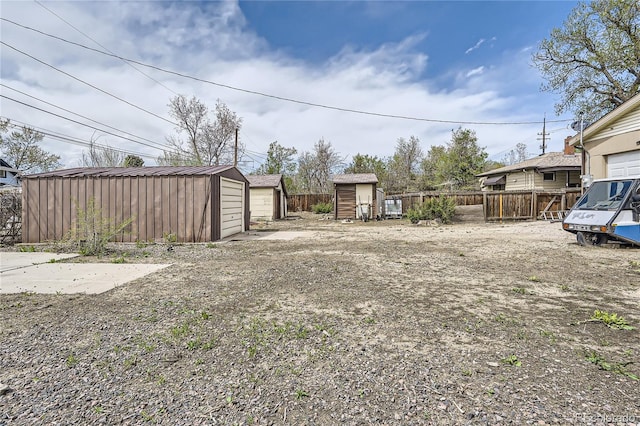 4835 Harlan St, Wheat Ridge, CO 80033 - view of yard with fence, an outdoor structure, and a shed