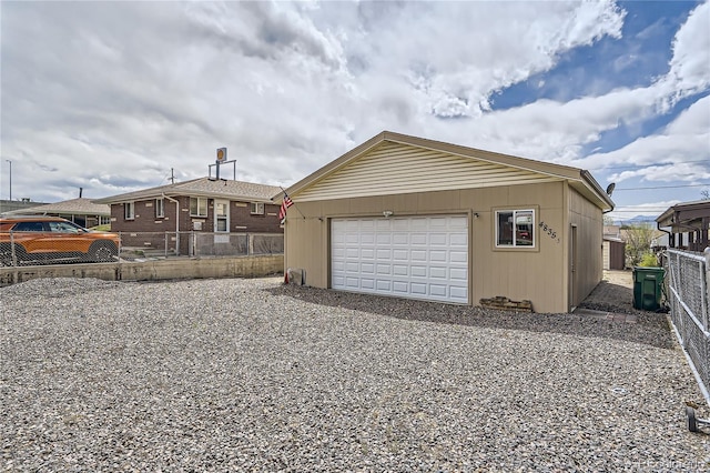 4835 Harlan St, Wheat Ridge, CO 80033 - garage featuring fence and driveway