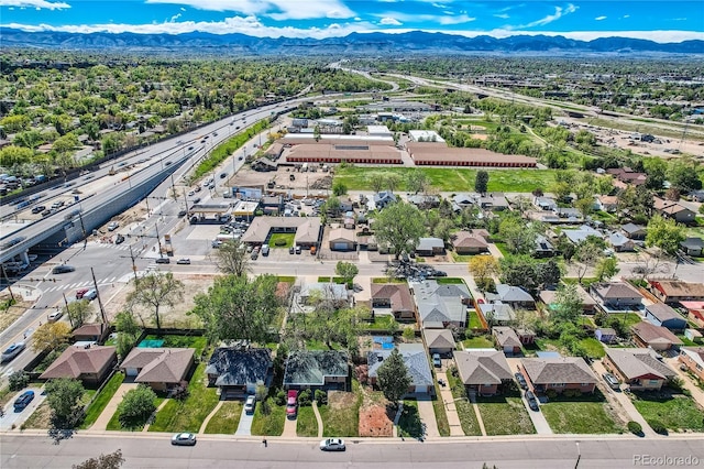 4835 Harlan St, Wheat Ridge, CO 80033 - aerial view of residential area featuring a mountainous background and a highway