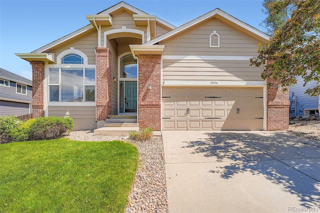 22436 E Maplewood Pl, Aurora, CO 80015 - view of front of house with brick siding, concrete driveway, a front yard, and an attached garage