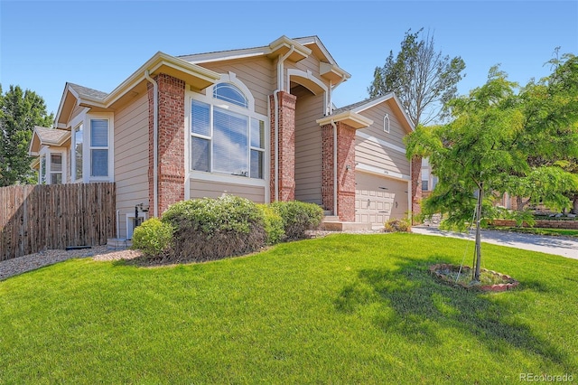 22436 E Maplewood Pl, Aurora, CO 80015 - view of front facade featuring brick siding, driveway, and an attached garage