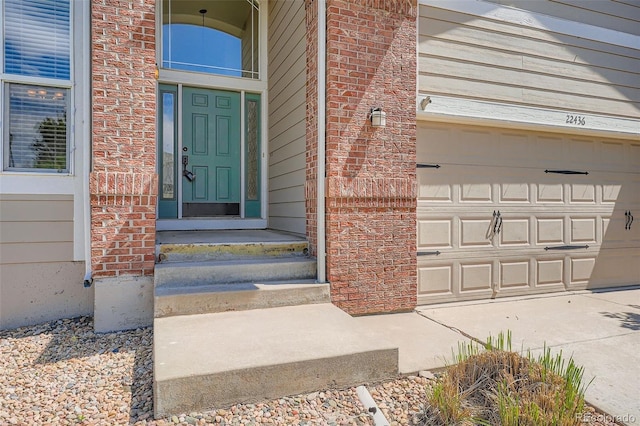 22436 E Maplewood Pl, Aurora, CO 80015 - entrance to property featuring a garage and brick siding