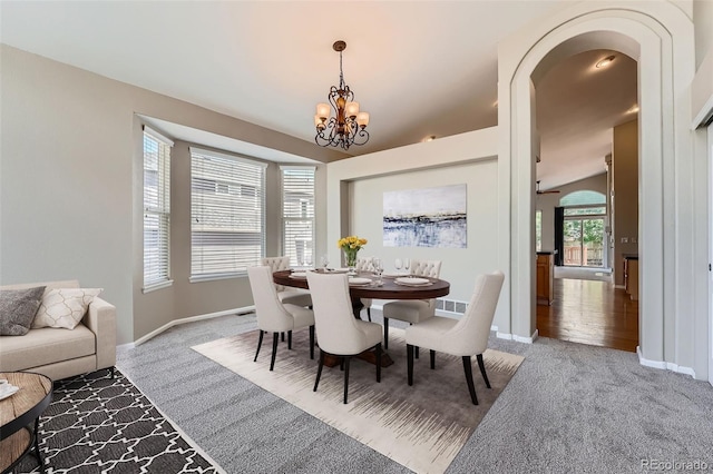 22436 E Maplewood Pl, Aurora, CO 80015 - carpeted dining room with a chandelier and baseboards