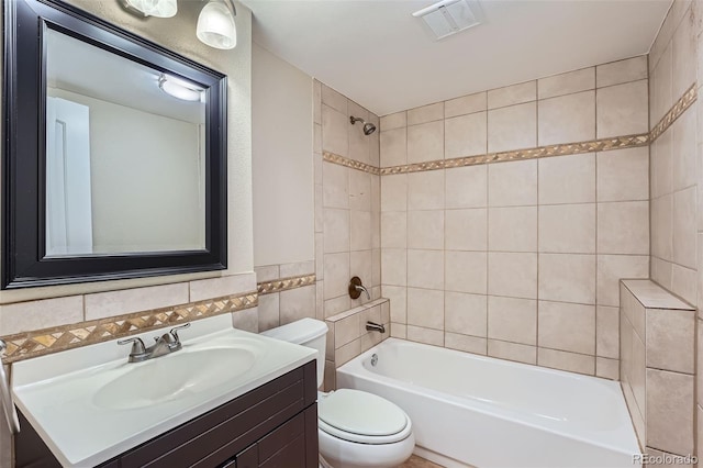22436 E Maplewood Pl, Aurora, CO 80015 - bathroom with vanity, tile walls, and  shower combination