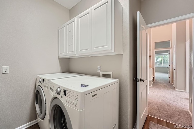 22436 E Maplewood Pl, Aurora, CO 80015 - washroom with separate washer and dryer, cabinet space, and carpet floors