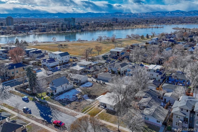 birds eye view of property featuring a water and mountain view