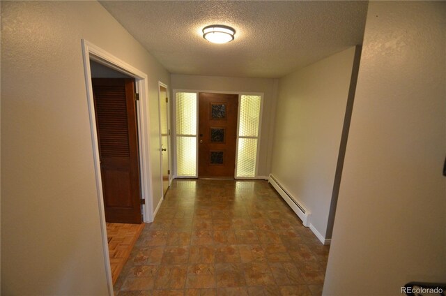 8450 Mason Cir, Westminster, CO 80031 - hall with a baseboard radiator, a textured ceiling, baseboards, and stone finish floors