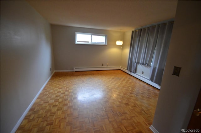 8450 Mason Cir, Westminster, CO 80031 - spare room featuring baseboard heating, baseboards, and a baseboard heating unit
