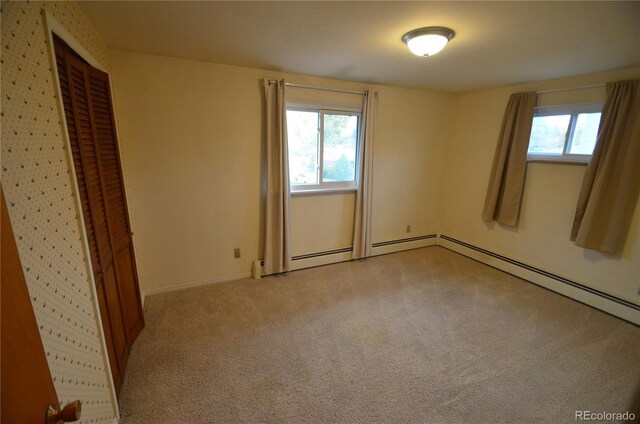 8450 Mason Cir, Westminster, CO 80031 - unfurnished bedroom with multiple windows, light carpet, and baseboards